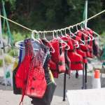 A line of free loaner life jackets hang at the Glenn Otto Park beach.