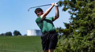 Reynolds senior golfer Mason Ho swings his club while competing on the links