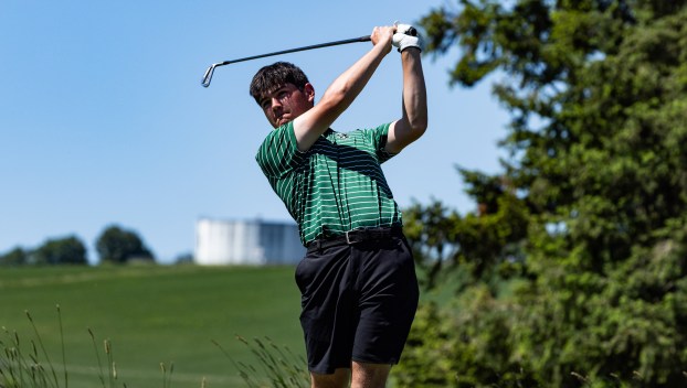 Reynolds senior golfer Mason Ho swings his club while competing on the links