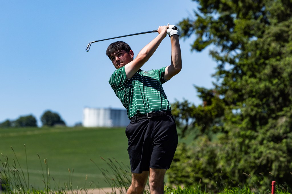 Reynolds senior golfer Mason Ho swings his club while competing on the links