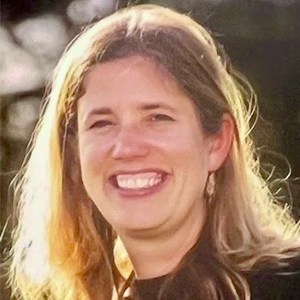 A headshot of Rhiannon Young, a Corbett Middle School teacher, who is smiling