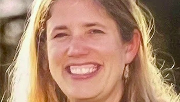 A headshot of Rhiannon Young, a Corbett Middle School teacher, who is smiling