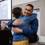 Reynolds junior Xavier Juarez hugs a Gresham City Councilor.