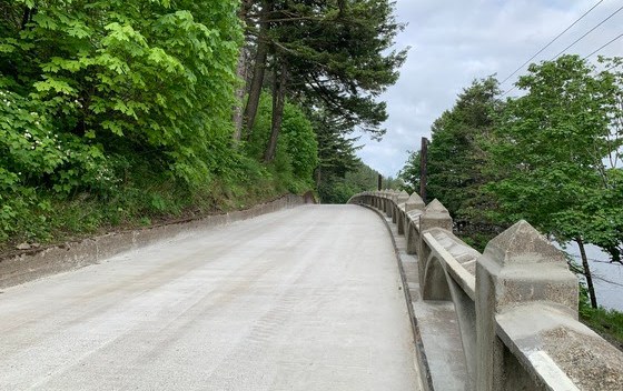 The viaduct on the Historic Highway after repairs/renovations, trees line the side of the roadway